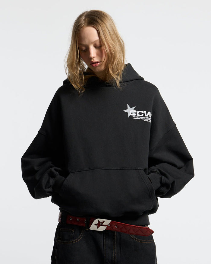 ASTRO HOODIE BLACK - black star print hoodie, front view on female model - Cold Culture #woman