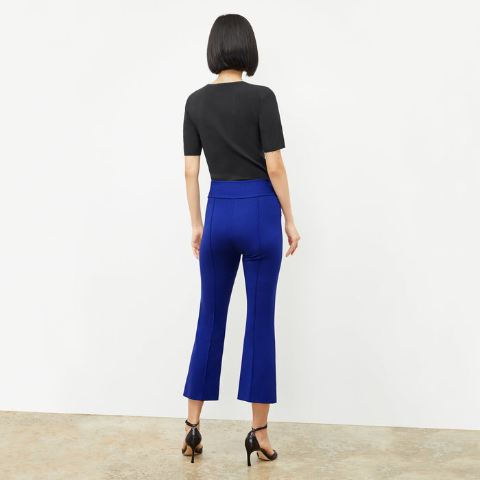 Front image of a woman standing wearing the Choe Top in Black | Exclude