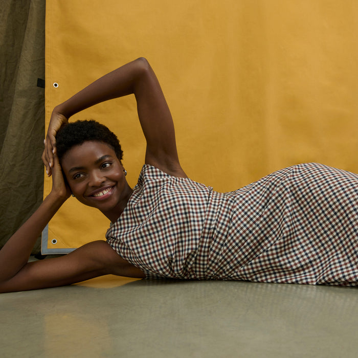 image of a woman wearing the jeannine dress in windowpane sharkskin
