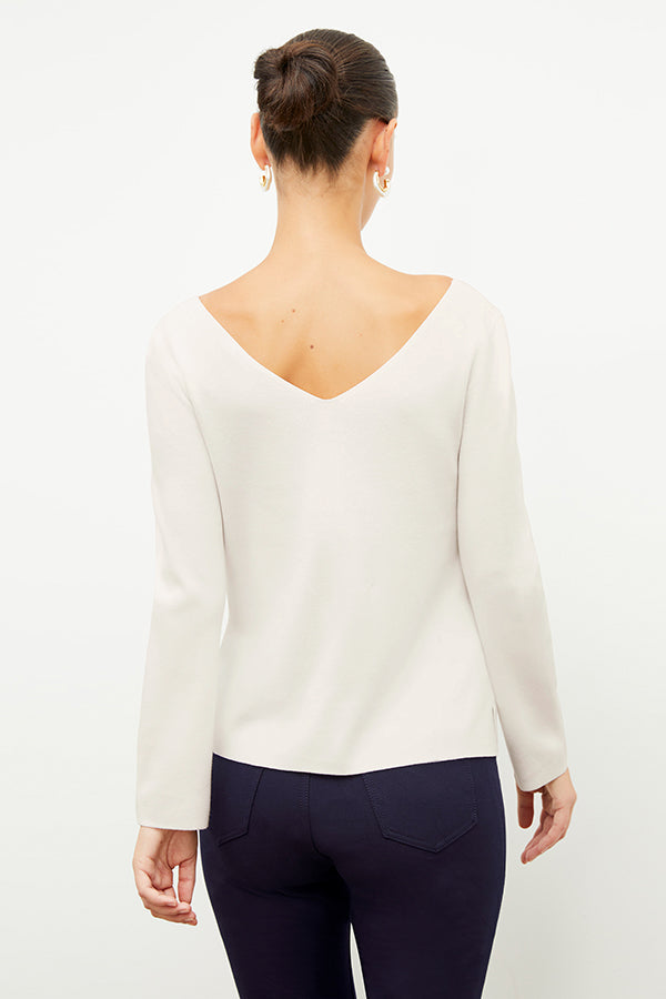 Back image of a woman wearing the kara top in ivory | Exclude | Grid Hover