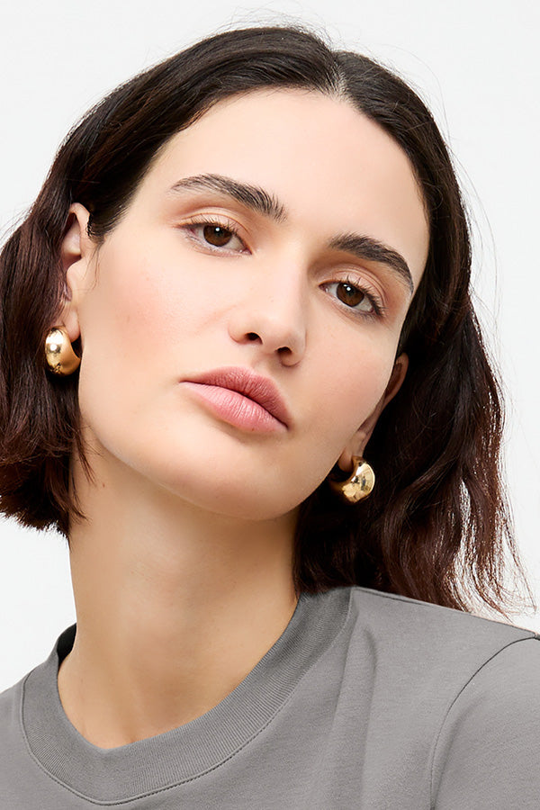 image of a woman wearing the karis earring in gold | Exclude | Grid Hover