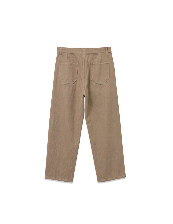 Back view of Kura Field Pleated Trousers showcasing the relaxed wide-leg shape and clean back patch pockets.