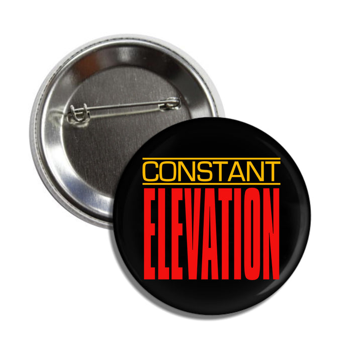 A round pin-back button by Constant Elevation features CONSTANT ELEVATION in bold yellow and red text on a black background, shown from both the front and back.
