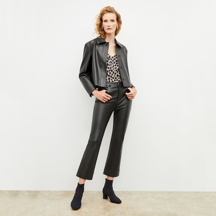 Front image of a woman wearing the nicky jacket in black | Exclude