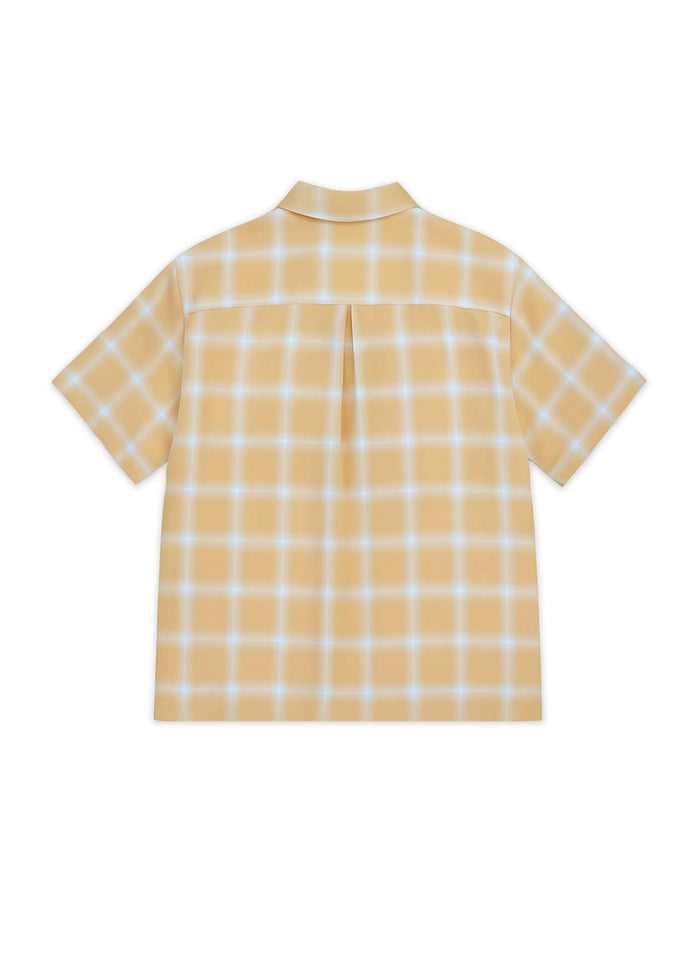 Back view of an ombre plaid shirt in yellow showing soft tones and comfortable style.