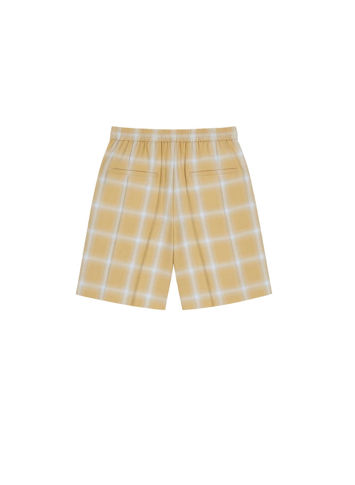 Ombre plaid shorts in yellow featuring relaxed fit and simple pocket details.