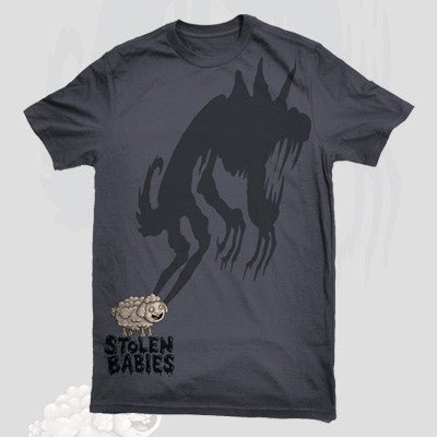 A dark Stolen Babies t-shirt with a large shadowy monster reaching for a small, smiling sheep and Stolen Babies written below.