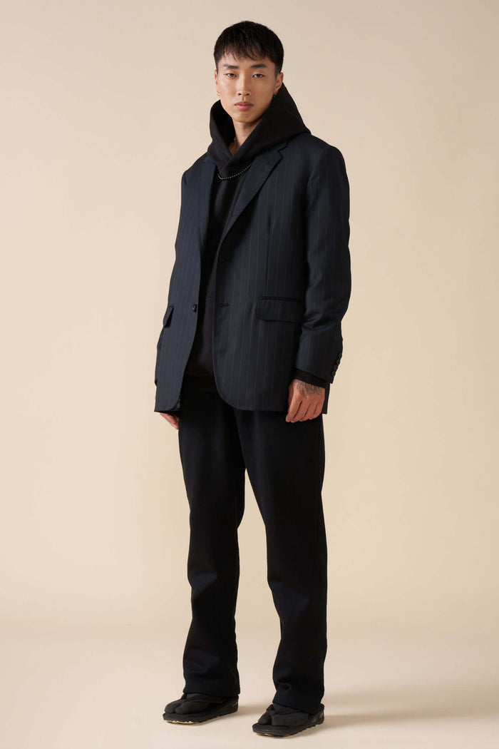 model wearing black straight leg joggers front view