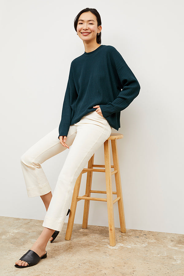 Front image of a woman wearing the Tyler Sweatshirt - Geo Micro Knit in Deep Sea | Exclude