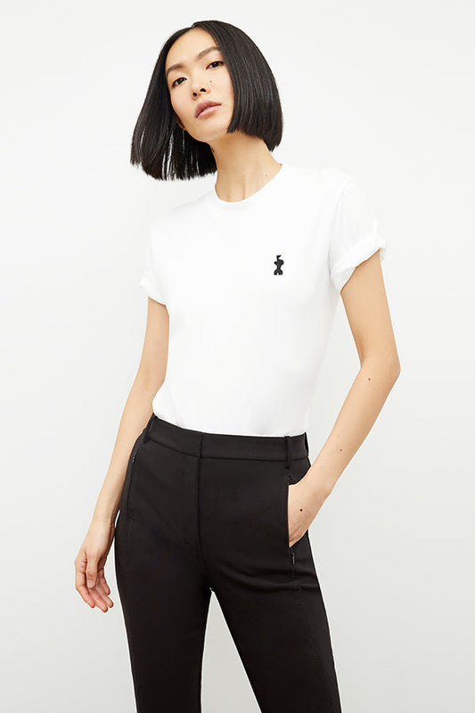 front image of a woman wearing the leslie t-shirt embroidered in white | Exclude | Grid