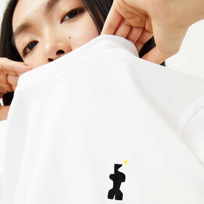 front image of a woman wearing the leslie t-shirt embroidered in white