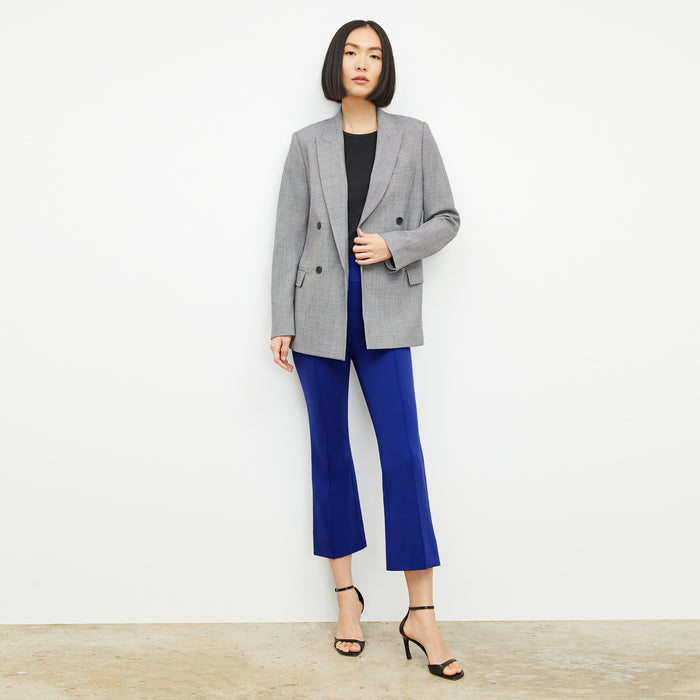 front image of a woman wearing the allyn pants in electric blue