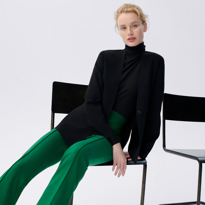 front image of a woman wearing the allyn pants in shamrock