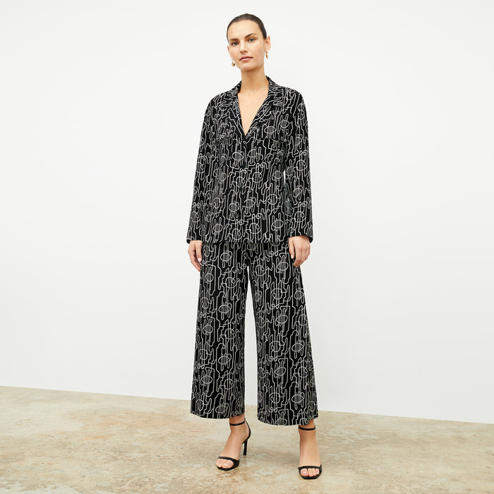 front image of a woman wearing the alyssa jacket in symphony print
