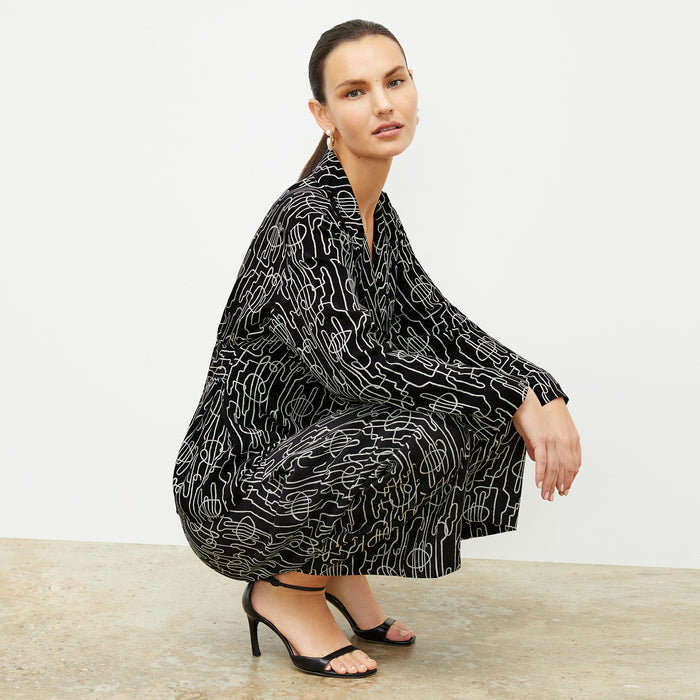 front image of a woman wearing the alyssa jacket in symphony print