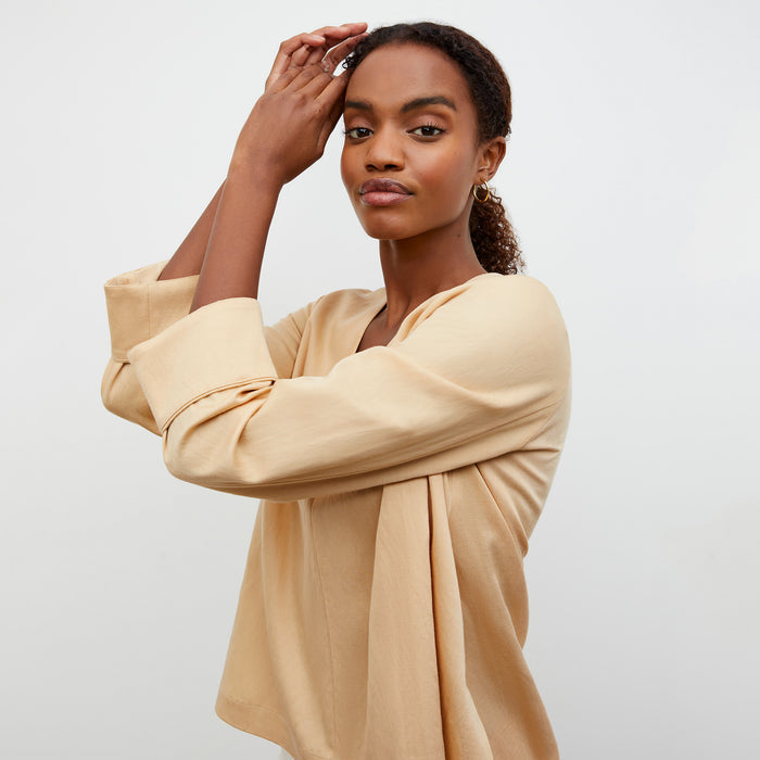 Side image of a woman wearing the Annette Top - Everyday Twill in Butter
