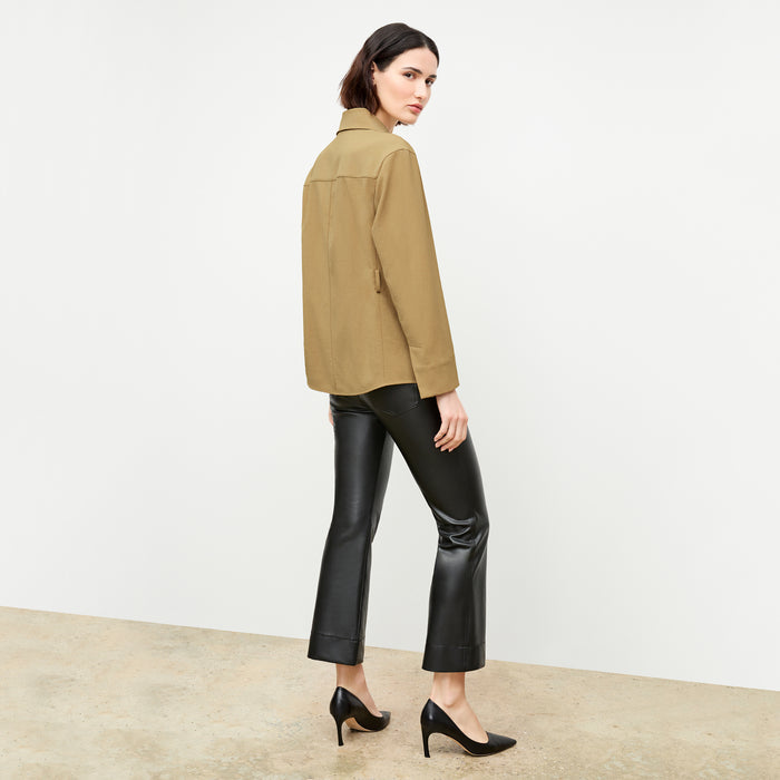 back image of a woman wearing the avelyn jacket in macaroon