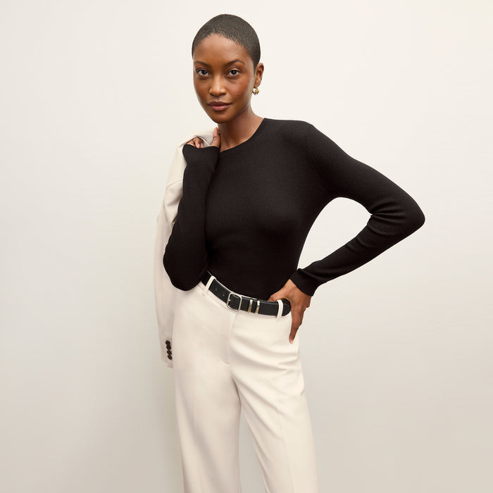 front image of a woman wearing the beck sweater in black | Lead
