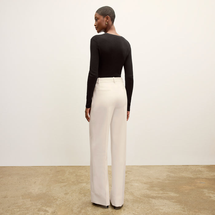 back image of a woman wearing the beck sweater in black