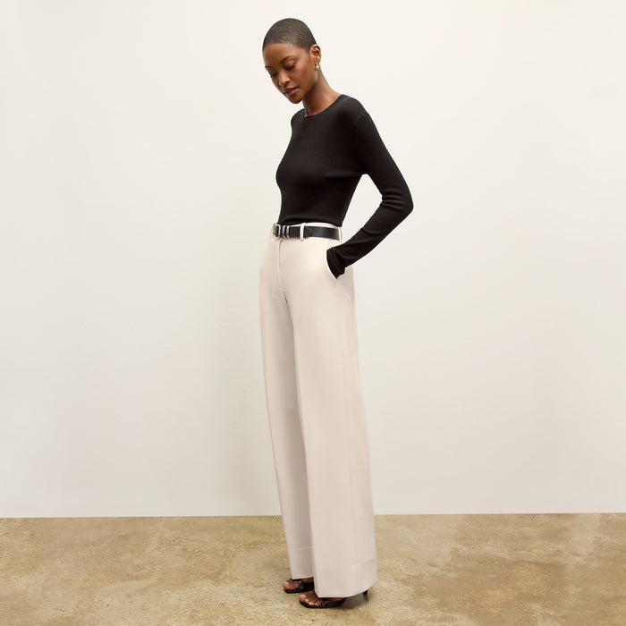 front image of a woman wearing the beck sweater in black