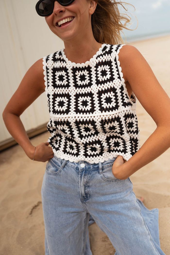 Black and white crochet tank top, three quarter view