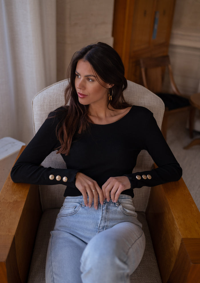 Black Yael bodysuit wrist button detail