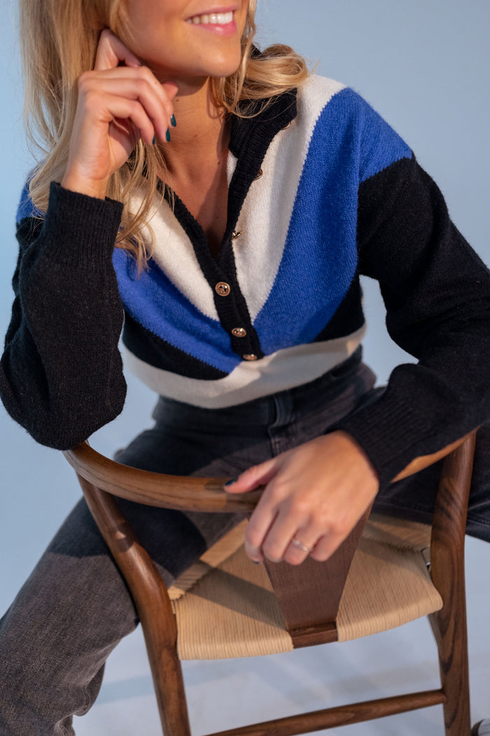 Woman wearing blue colorblock sweater