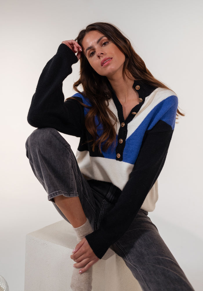Front view of blue and ecru chevron sweater