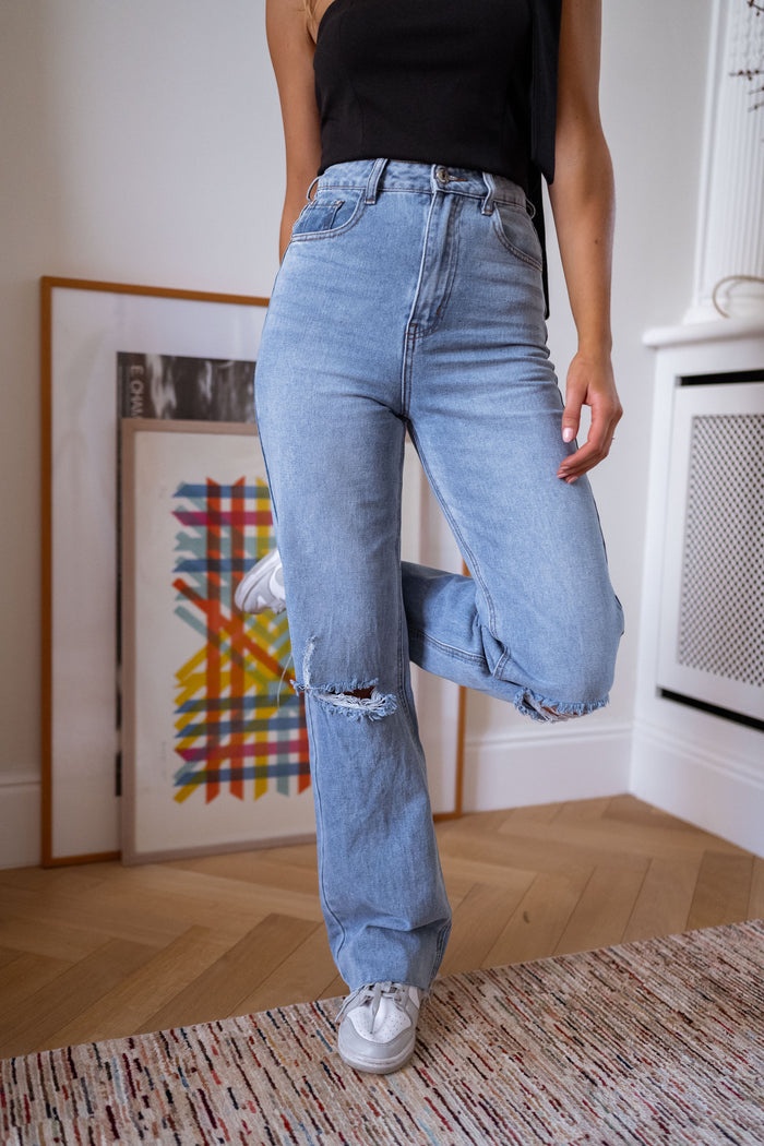 Blue Houston high-rise flared jeans with knee rips, front view