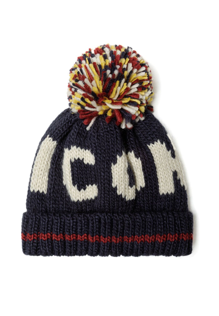 Boys jacquard hat in navy with a colorful pom pom and knitted wording, front view.
