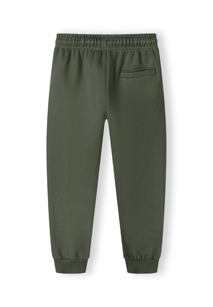 Boys joggers in khaki with ribbed ankle cuffs and back pocket, back view.