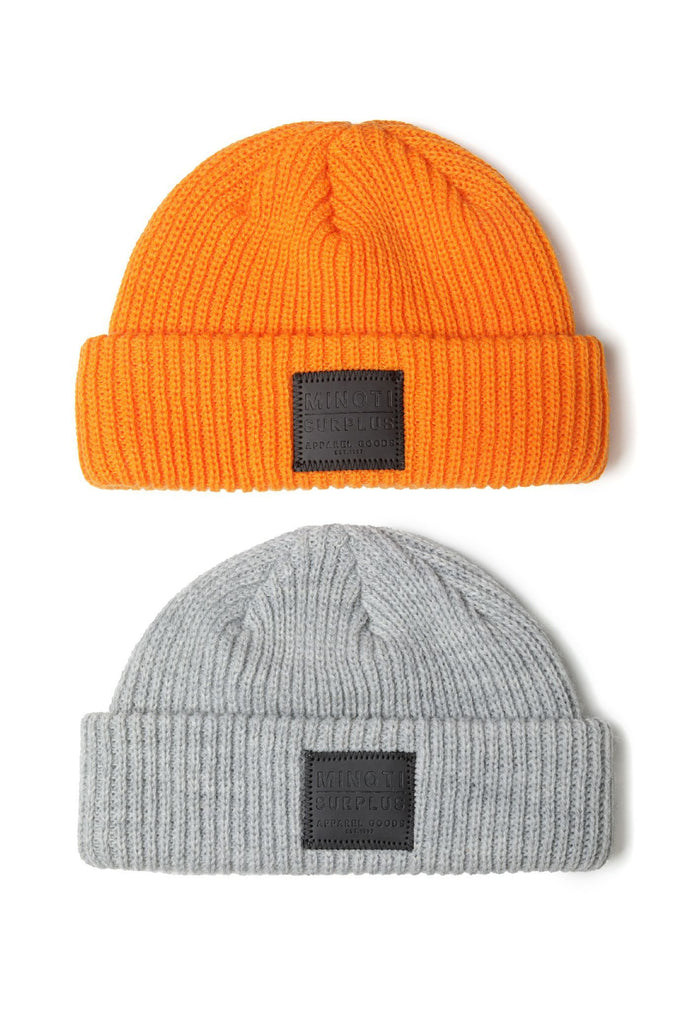 Two knitted fisherman hats for boys, bright orange and grey, featuring badge detail, front view.