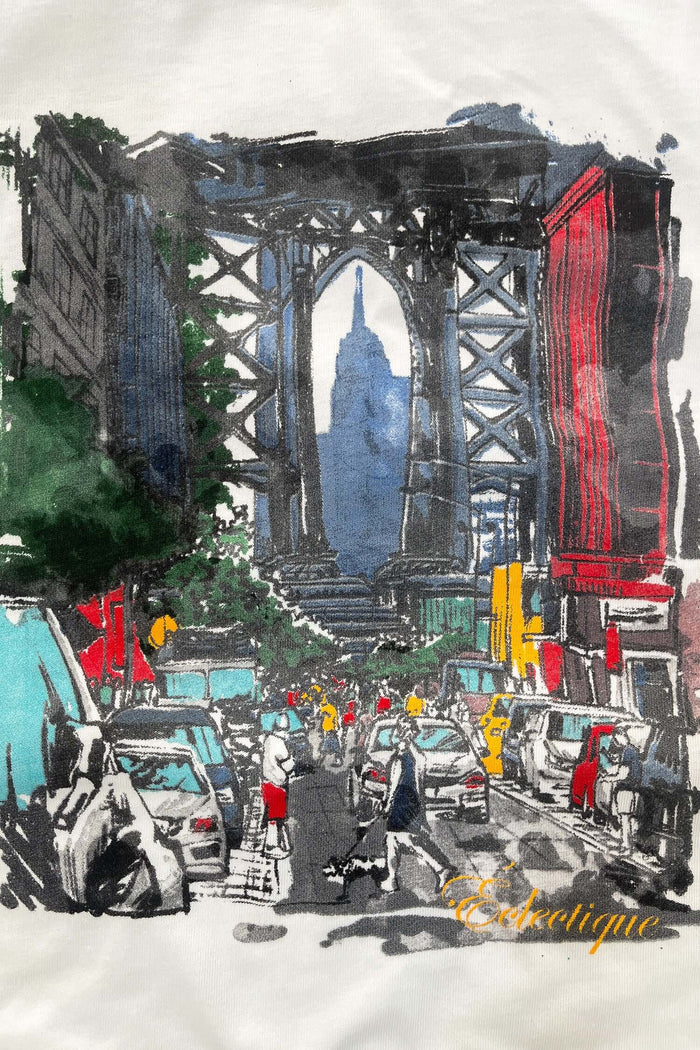 Brooklyn Bridge graphic t-shirt featuring vibrant artwork with the Empire State Building in the background.