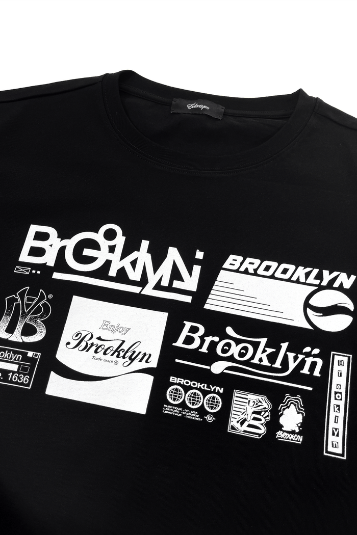 Brooklyn graphic t-shirt featuring printed white artwork on a black cotton tee, showcasing various Brooklyn designs.