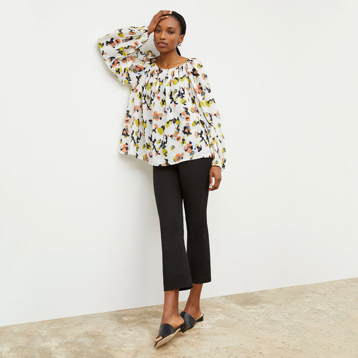 Front image of a woman wearing the Camilla top in meadow print linen | Lead