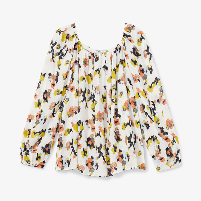 Front image of a woman wearing the Camilla top in meadow print linen