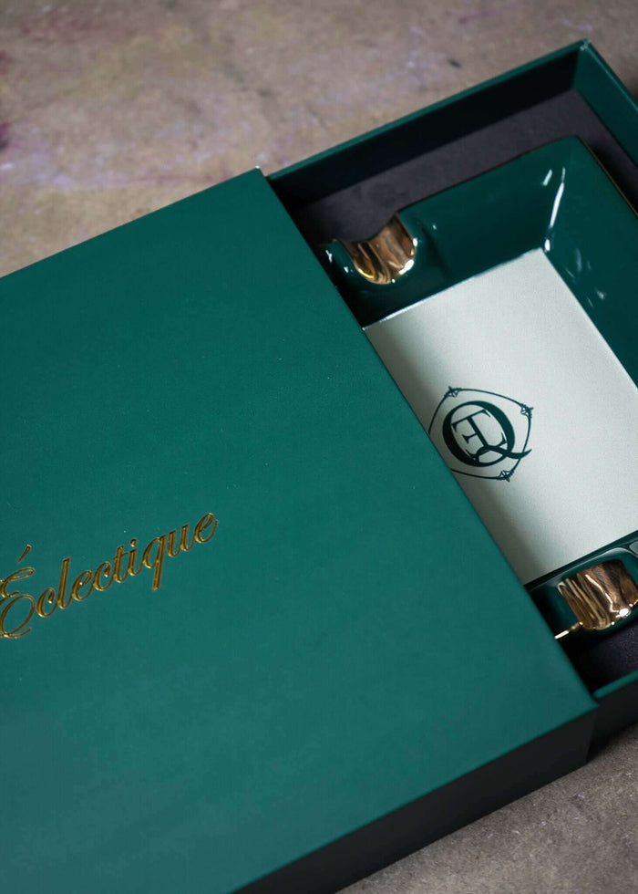 Monogram Gold Trim Ceramic Catchall Tray displayed in elegant green packaging with golden logo.