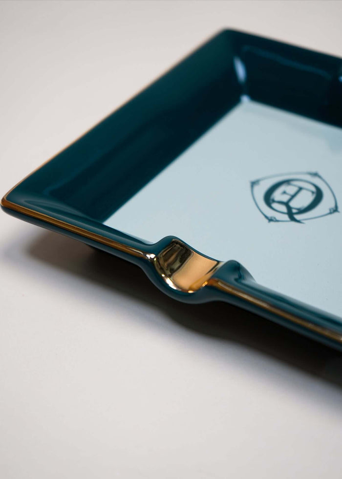 Monogram gold trim ceramic catchall tray with elegant design and polished finish.