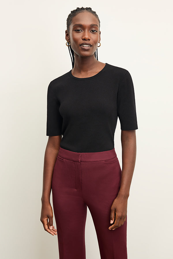 Front image of a woman wearing the choe top in black | Exclude