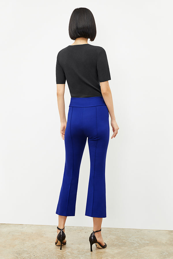 Back image of a woman wearing the choe top in black | Exclude