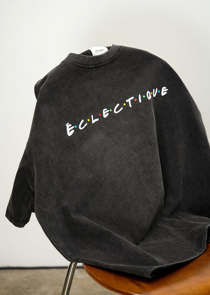 detail view of Classic Friends logo t-shirt, acid-wash black heavyweight cotton with relaxed boxy fit.