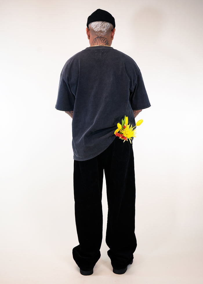 standing model wearing Éclectique classic friends logo T-shirt