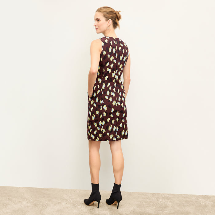 back image of a woman wearing the constance dress in bengal jacquard