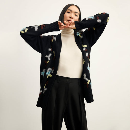 front image of a woman wearing the cookie cardigan in confetti | Lead