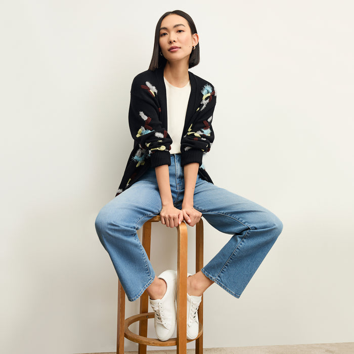 front image of a woman wearing the cookie cardigan in confetti