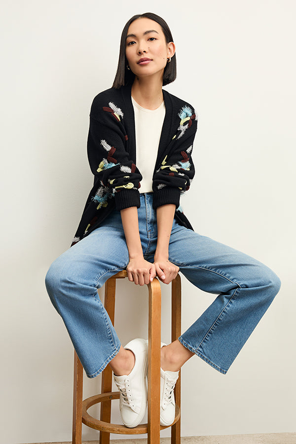 front image of a woman wearing the cookie cardigan in confetti | Exclude | Grid Hover