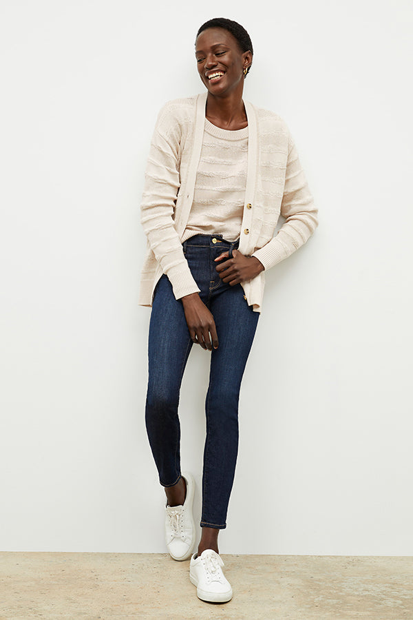front image of a woman wearing the cookie cardigan in moonbeam | Exclude | Grid