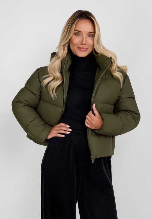 Women short quilted jacket in khaki with a high collar and hood, front view.