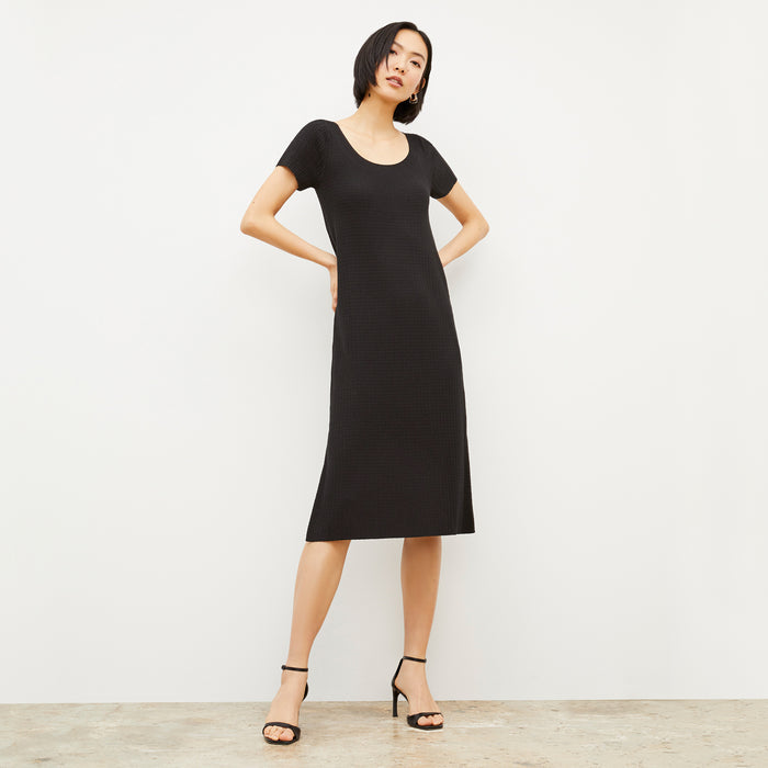 Front image of a woman wearing the Danica Dress - Geo Micro Knit in Black | Lead