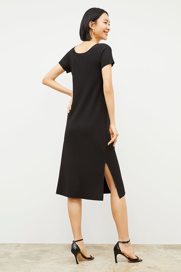 Back image of a woman wearing the Danica Dress - Geo Micro Knit in Black | Grid Hover | Exclude